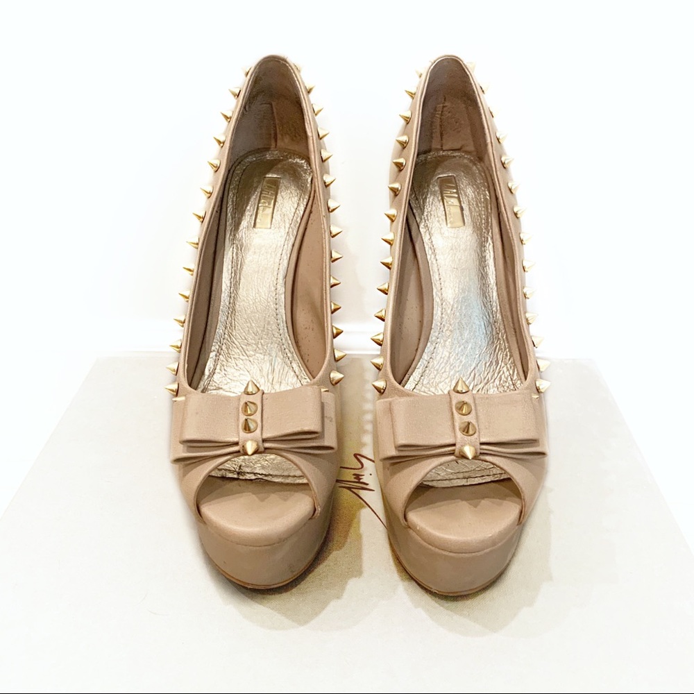 Nude stilettos with gold spikes